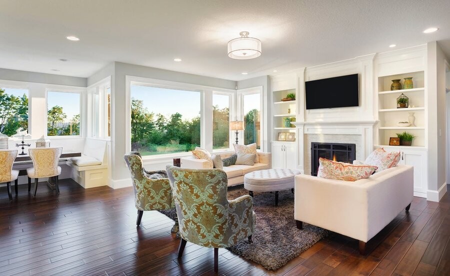 A living room space featuring various smart home solutions like lighting fixtures and home AV.
