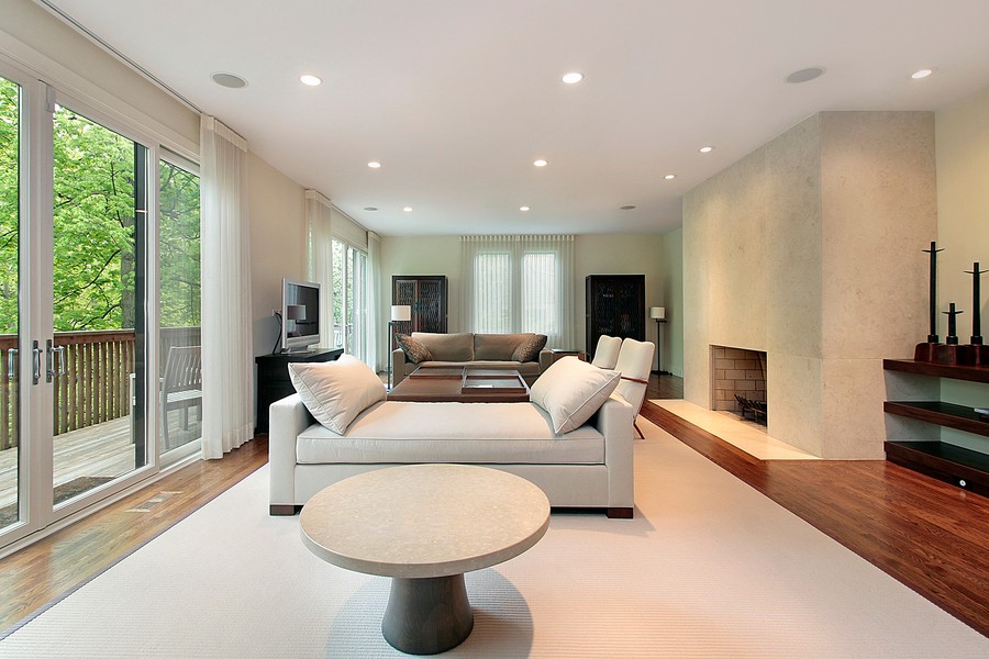 A modern living room with beige furniture.